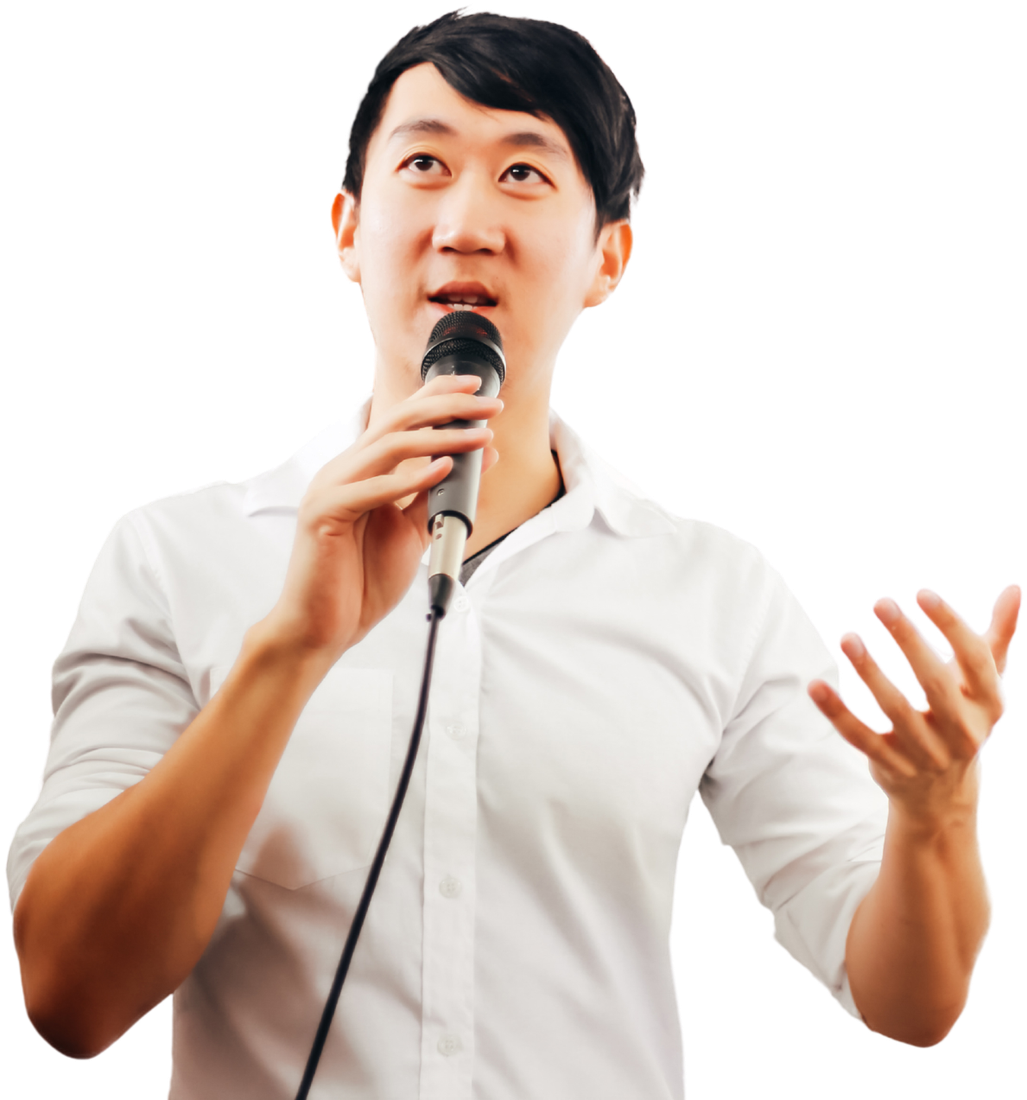 A professional speaking into a microphone at a presentation